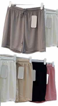 Elastic beach shorts and plain fluid fabric